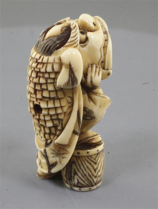 A Japanese ivory netsuke of a shishimai dancer, Meiji period, signed Nagatame, h. 5.1cm